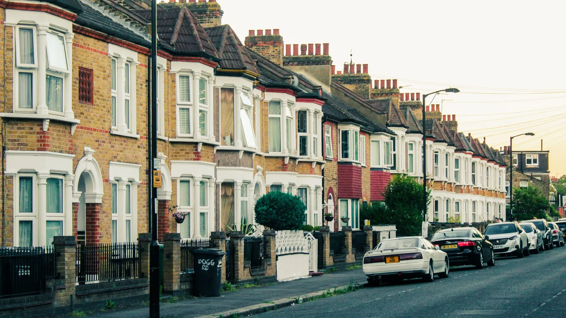 Row of brick terraced houses along a street