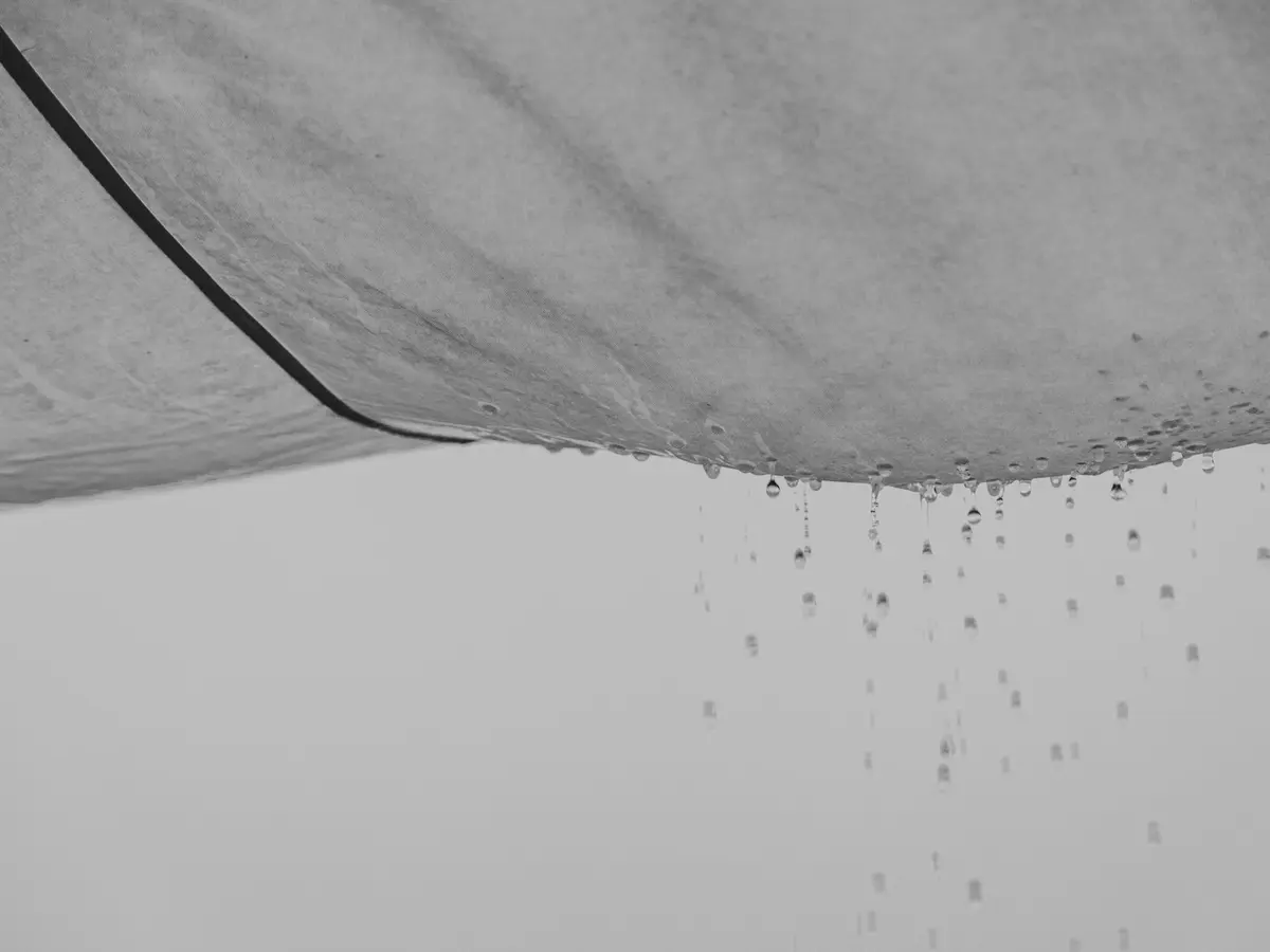 Sagging ceiling with water dripping from it